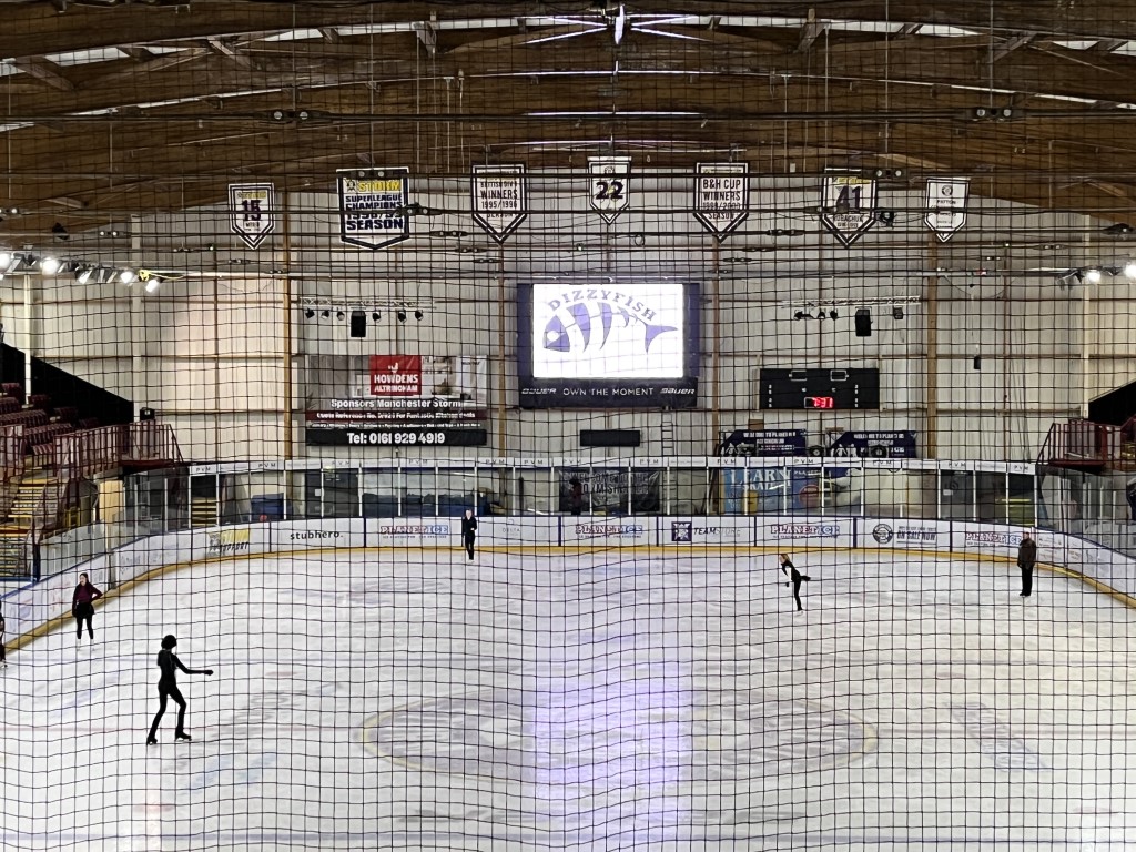Altrincham Ice Arena showing large screen at far end with Dizzyfish logo on the screen.
